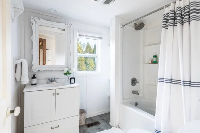 a bathroom with a sink a toilet and a bathtub