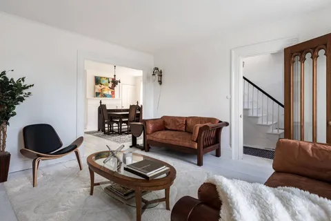 a living room with furniture or couch and a potted plant