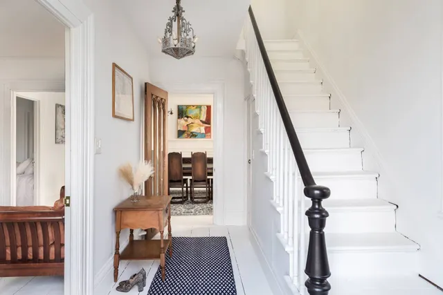 a view of entryway with furniture and rug