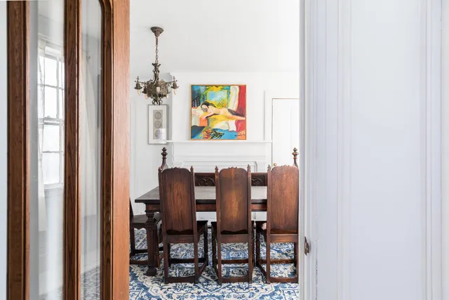 a dining room with furniture and rug floor