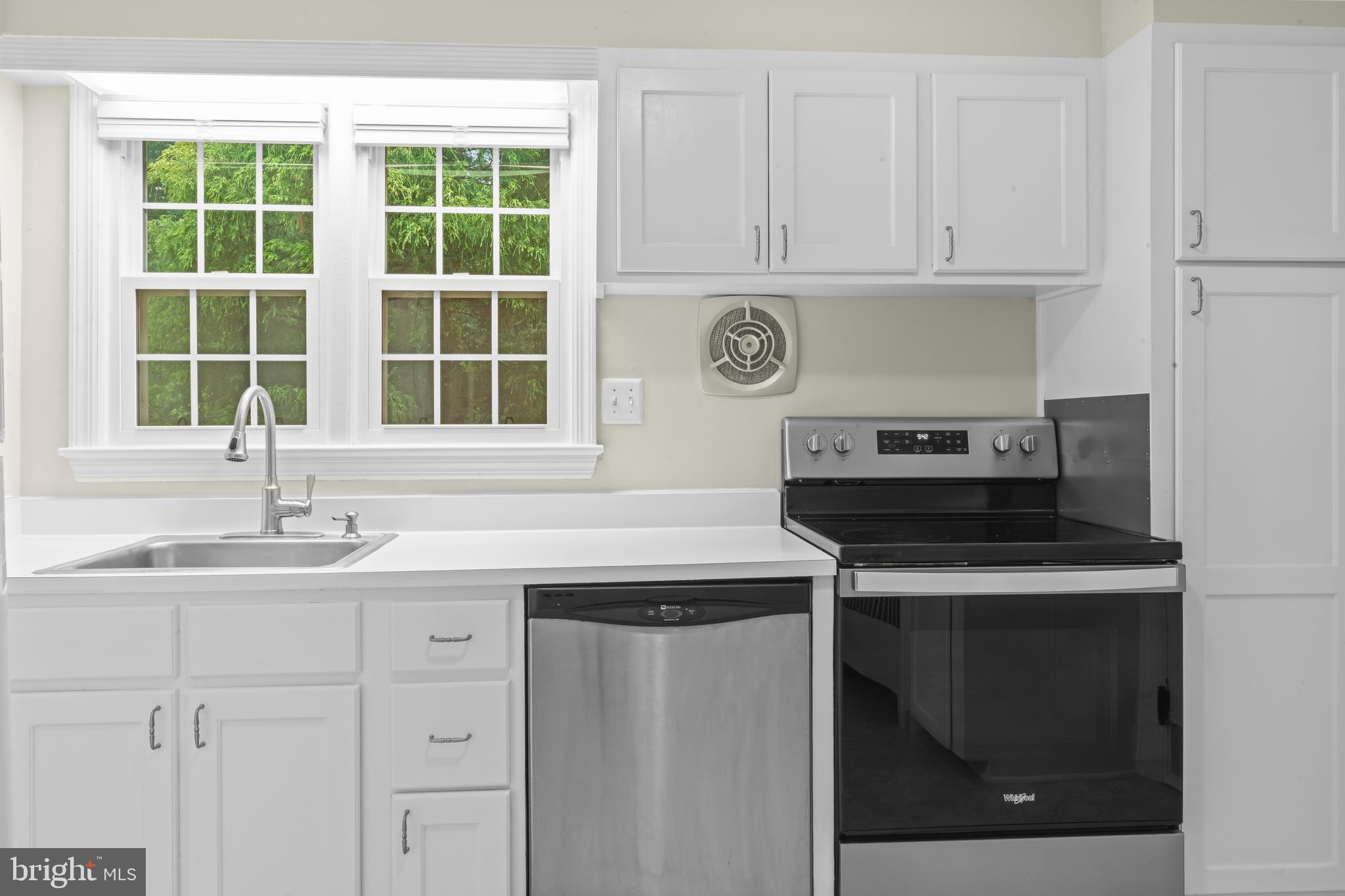 12131 Waples Mill Road Oakton, VA 22124 - Photo 17 of 40 a kitchen with stainless steel appliances granite countertop a sink and a stove
