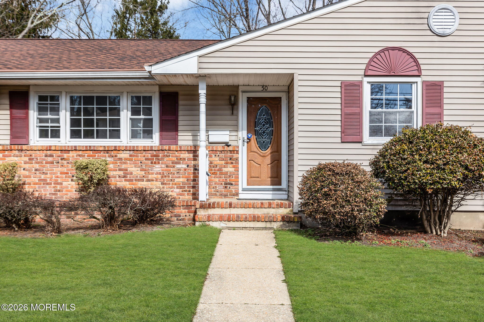50 Westbrook Road Howell, NJ 07731 - Photo 3 of 73 a front view of a house with garden