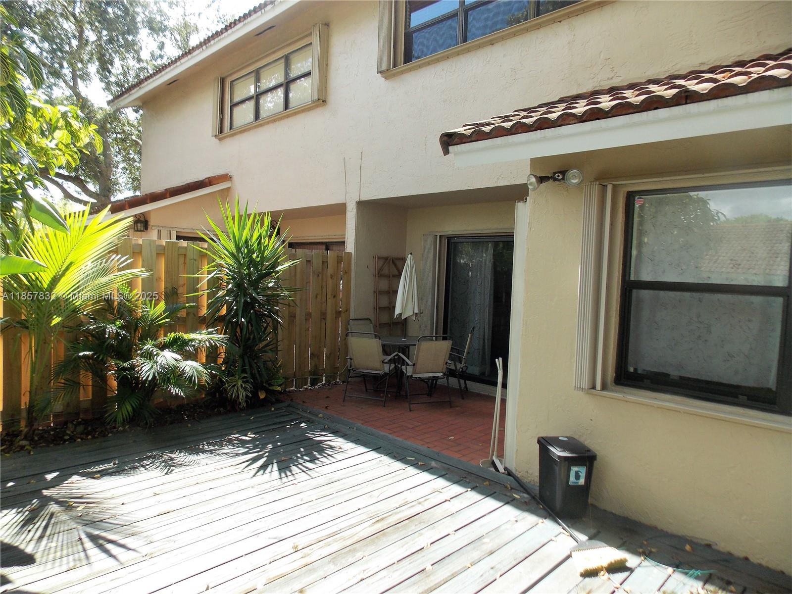 8906 Southwest 113th Pl Circle East Miami, FL 33176 - Photo 11 of 15 a vase of flowers sitting on a wooden floor