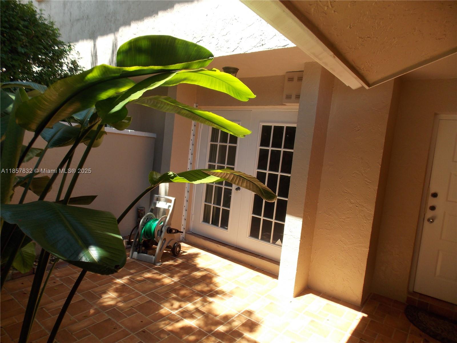8906 Southwest 113th Pl Circle East Miami, FL 33176 - Photo 13 of 15 a view of a house with a yard