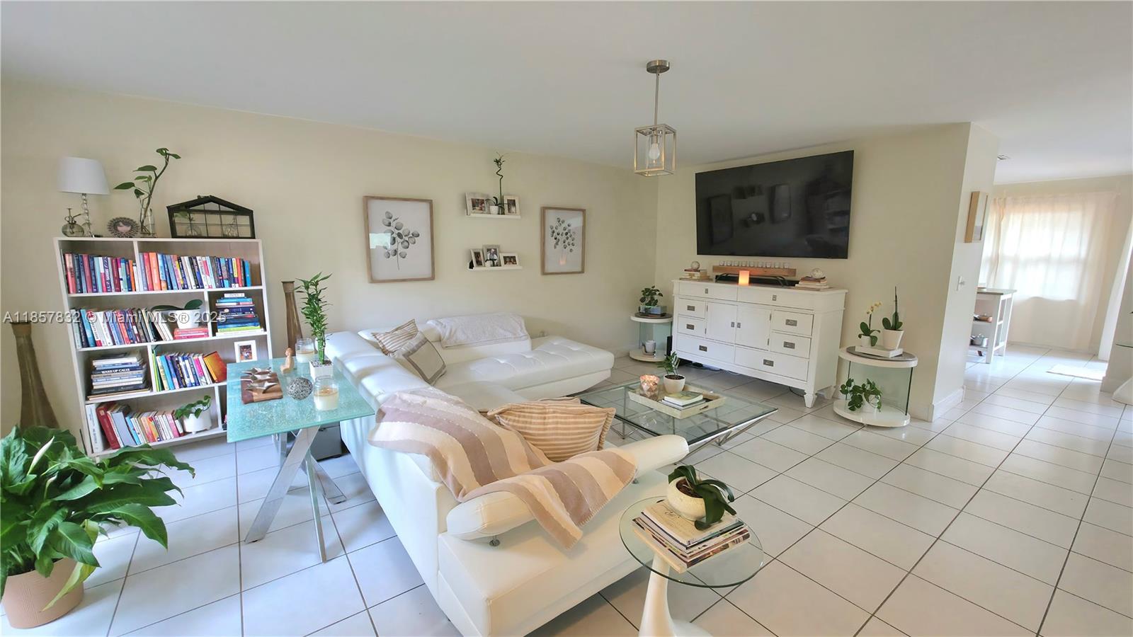 8906 Southwest 113th Pl Circle East Miami, FL 33176 - Photo 6 of 15 a living room with furniture and a flat screen tv