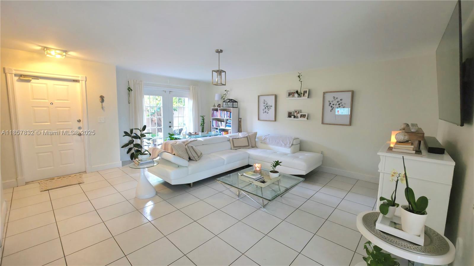 8906 Southwest 113th Pl Circle East Miami, FL 33176 - Photo 7 of 15 a living room with furniture and a potted plant