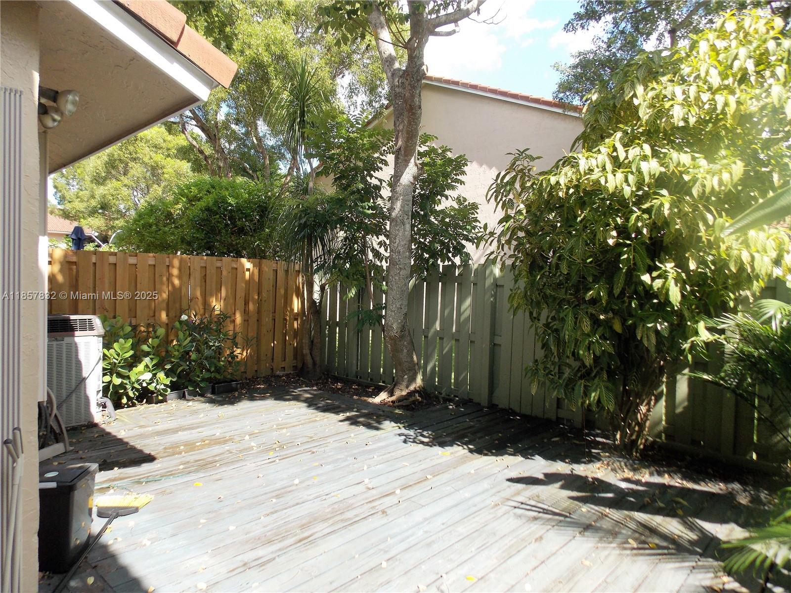 8906 Southwest 113th Pl Circle East Miami, FL 33176 - Photo 10 of 15 a backyard of a house with lots of green space