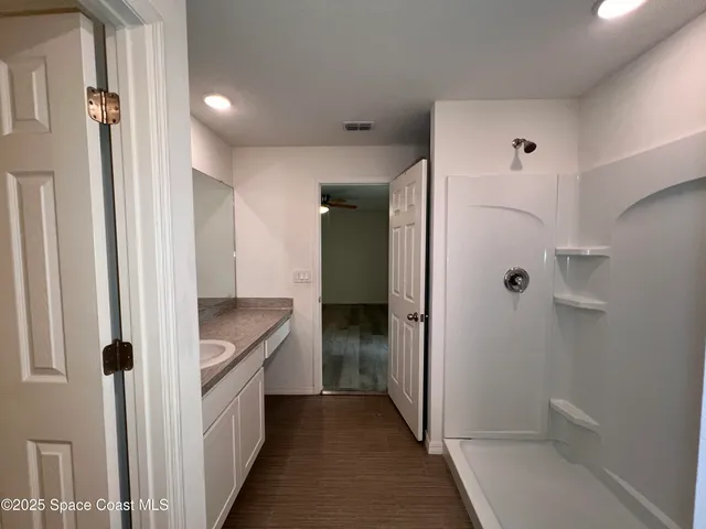 a bathroom with a tub and shower