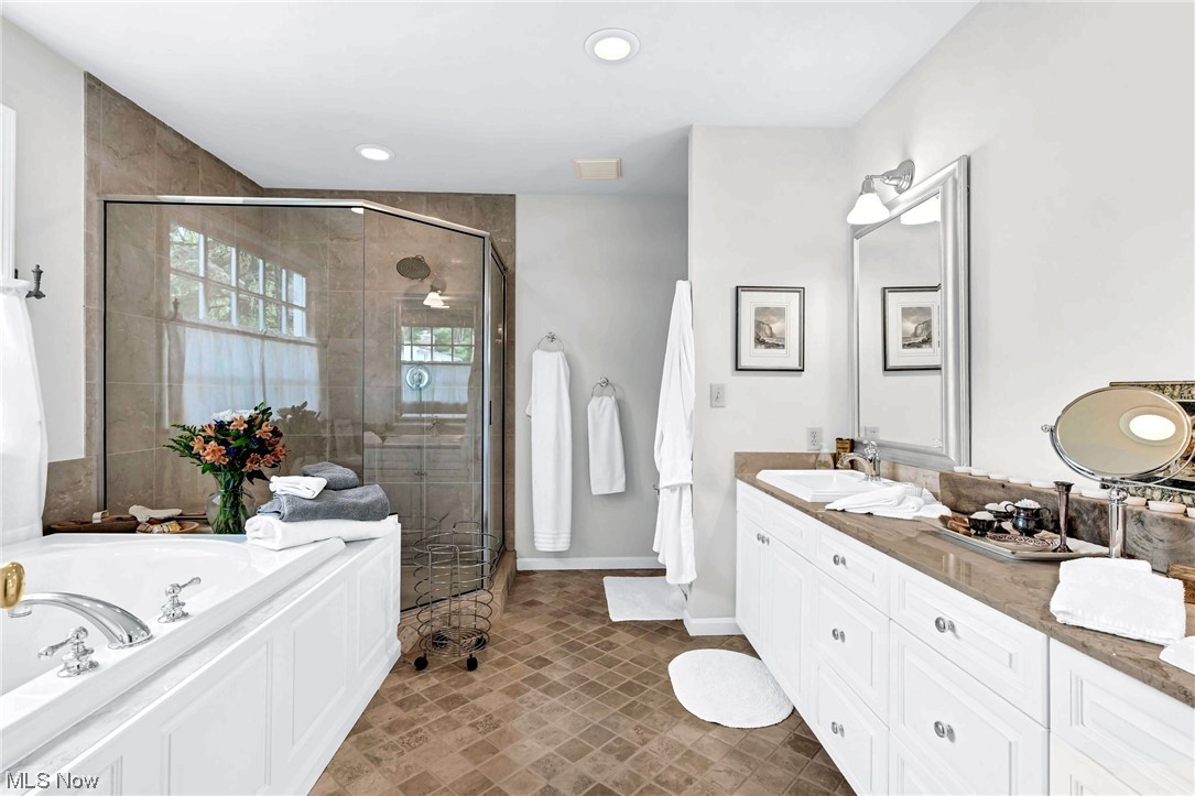 29500 Edgedale Road Cleveland, OH 44124 - Photo 18 of 35 Master Bath with large soaking tub, tiled shower and double sink vanity.