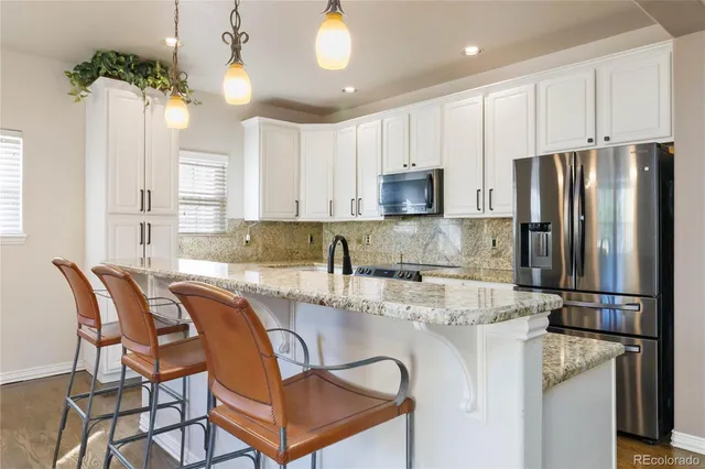 a view of a kitchen and dining room
