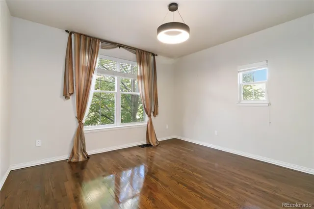 a view of a hallway with closet and bathroom