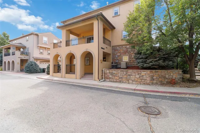 a view of a livingroom with furniture and a window