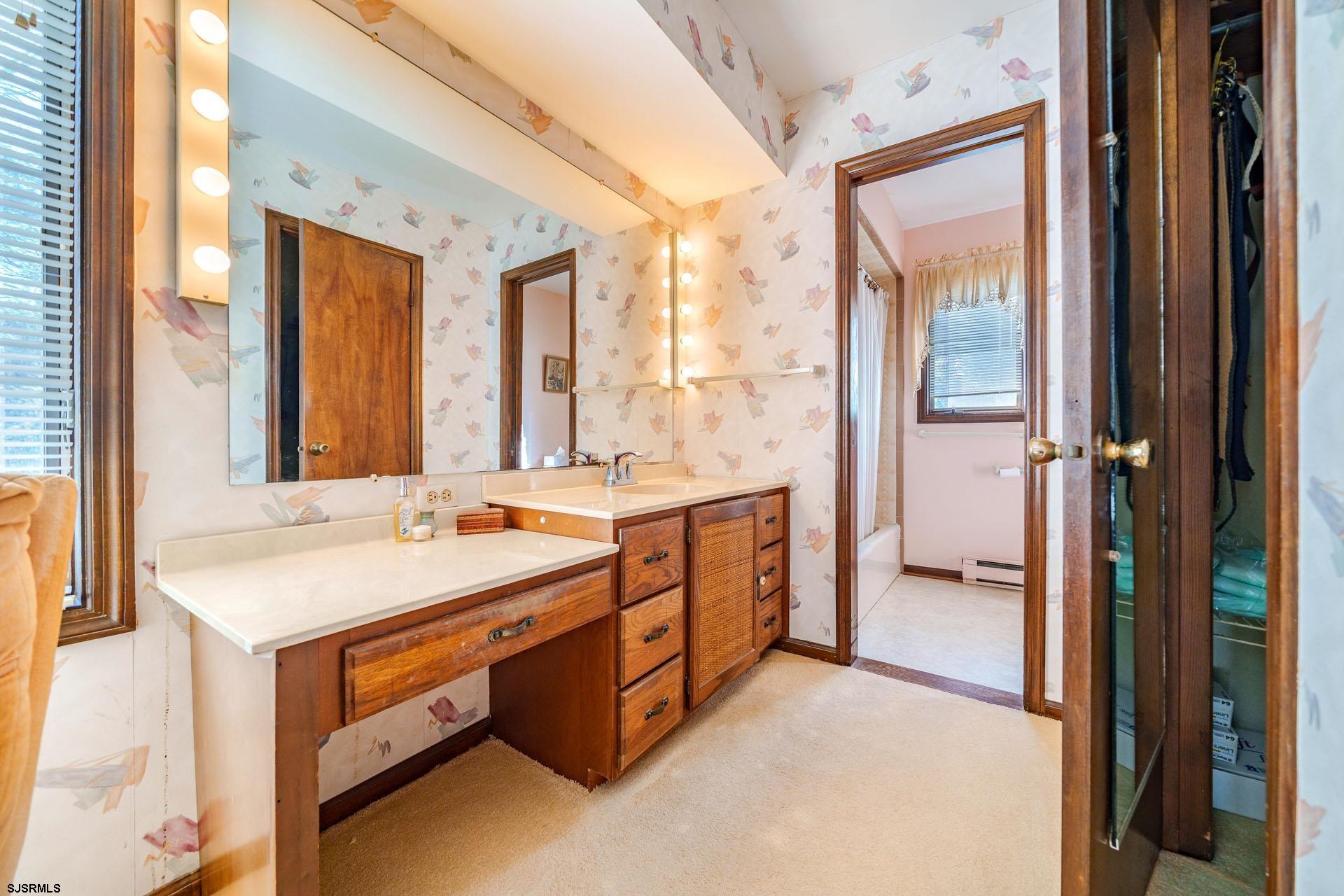 601 2nd Avenue Marmora, NJ 08223 - Photo 15 of 31 a spacious bathroom with a double vanity sink a mirror and a shower
