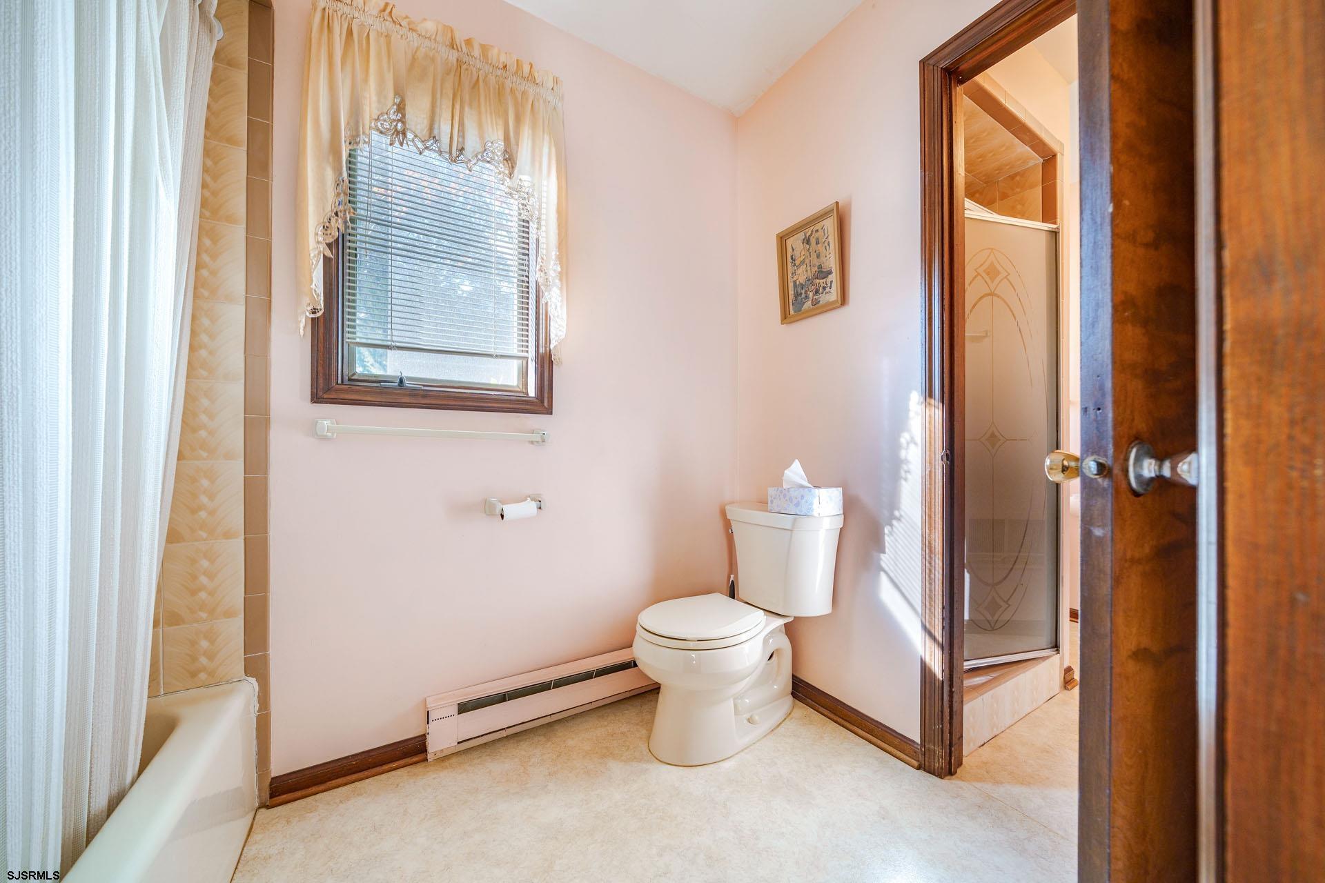 601 2nd Avenue Marmora, NJ 08223 - Photo 16 of 31 a white toilet sitting next to a bathroom sink