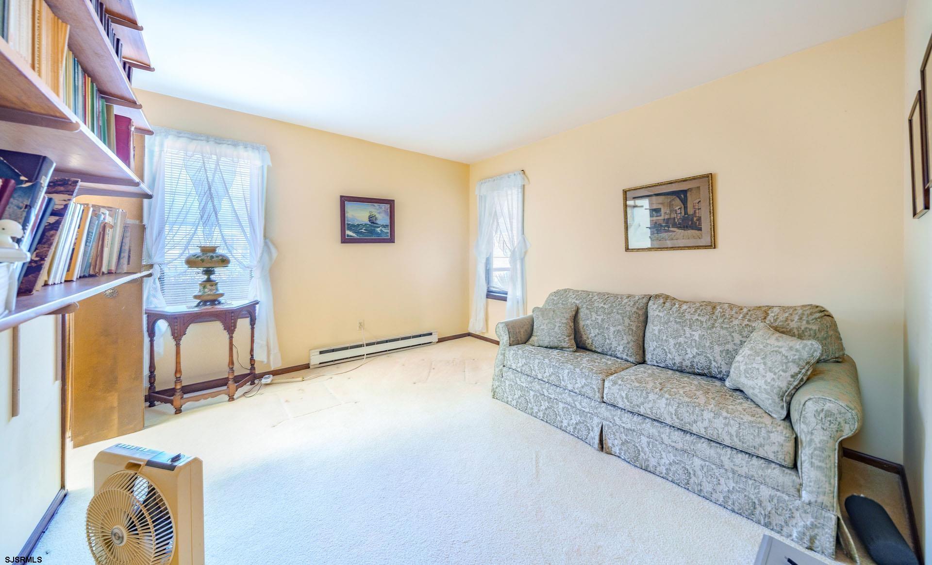 601 2nd Avenue Marmora, NJ 08223 - Photo 19 of 31 a living room with furniture and a flat screen tv