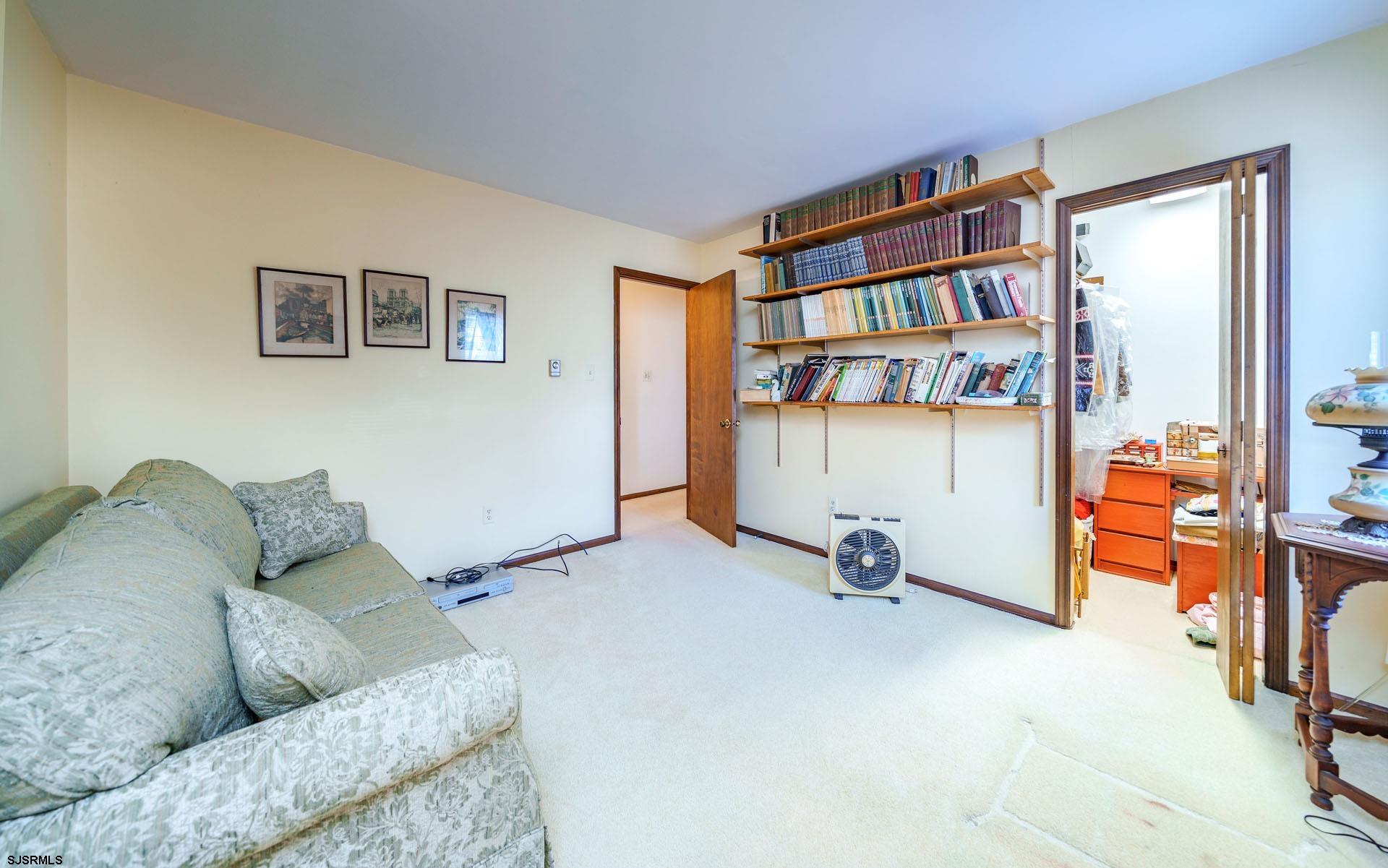 601 2nd Avenue Marmora, NJ 08223 - Photo 20 of 31 a living room with furniture and a book shelf