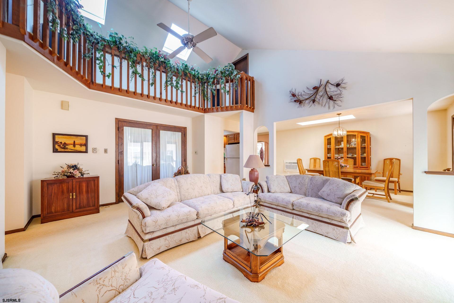 601 2nd Avenue Marmora, NJ 08223 - Photo 4 of 31 a living room with furniture ceiling fan and a rug