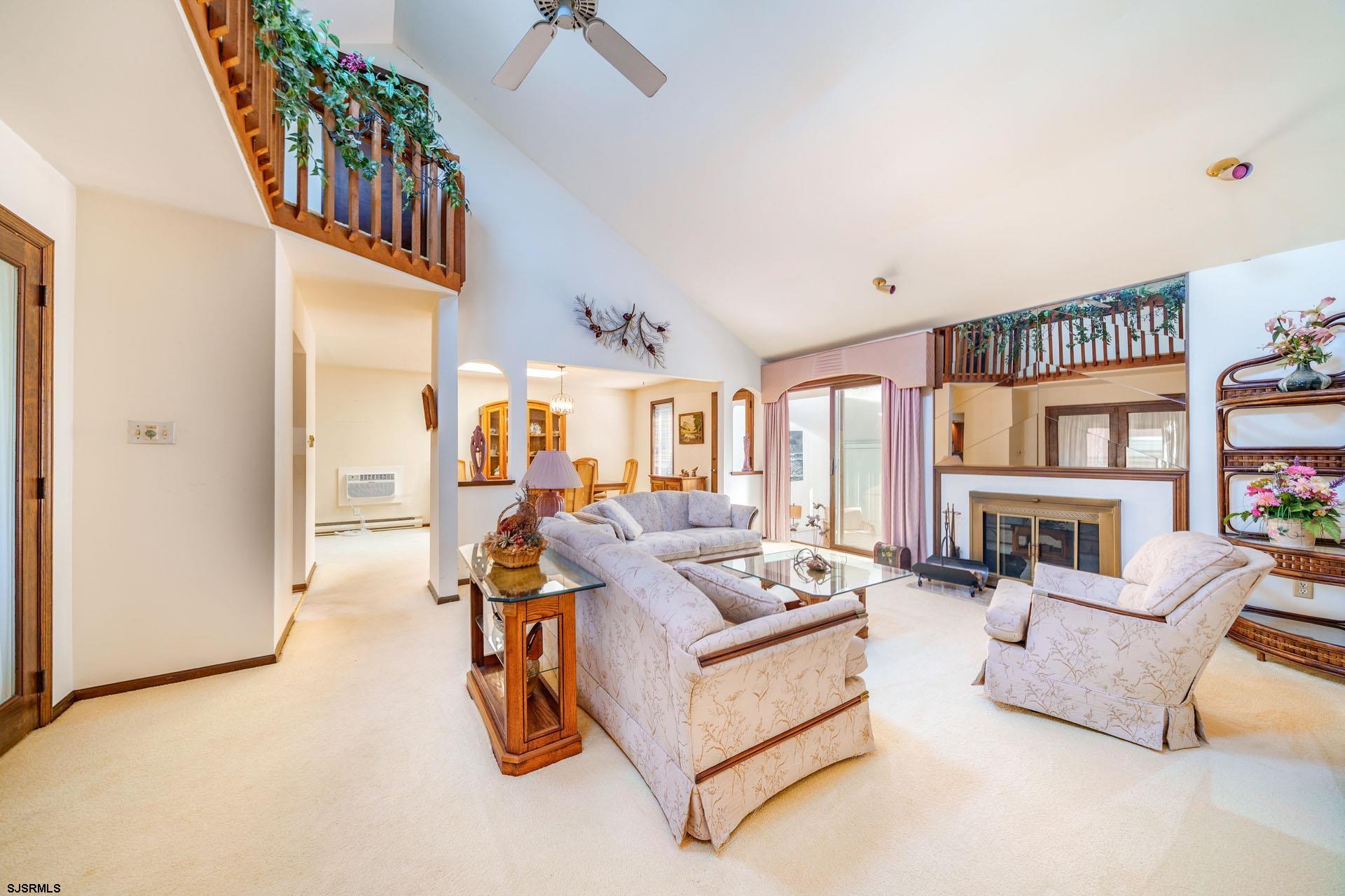 601 2nd Avenue Marmora, NJ 08223 - Photo 5 of 31 a living room with furniture and a chandelier