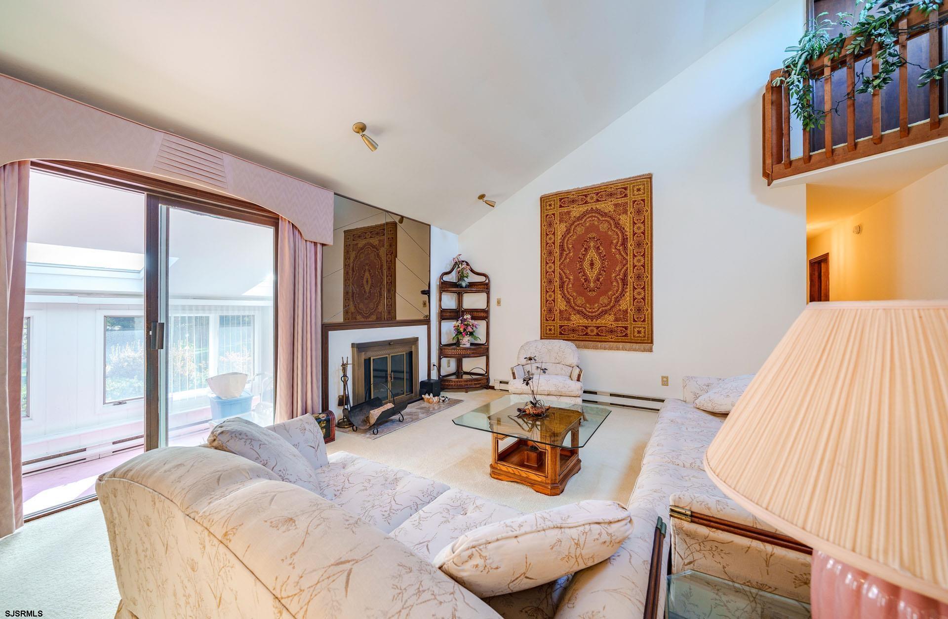 601 2nd Avenue Marmora, NJ 08223 - Photo 6 of 31 a bedroom with furniture and a fireplace