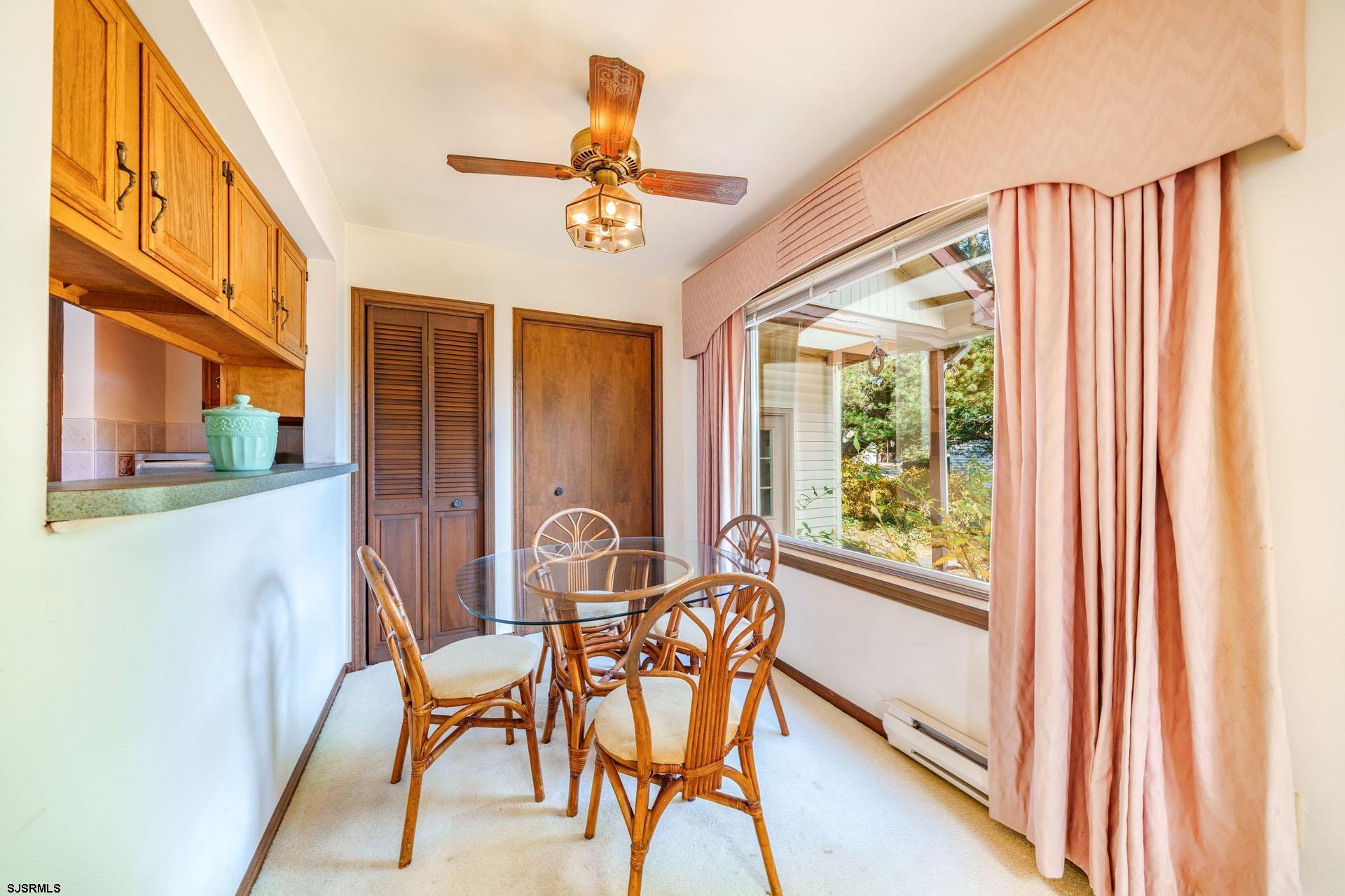 601 2nd Avenue Marmora, NJ 08223 - Photo 7 of 31 a view of a dining room with furniture window and wooden floor