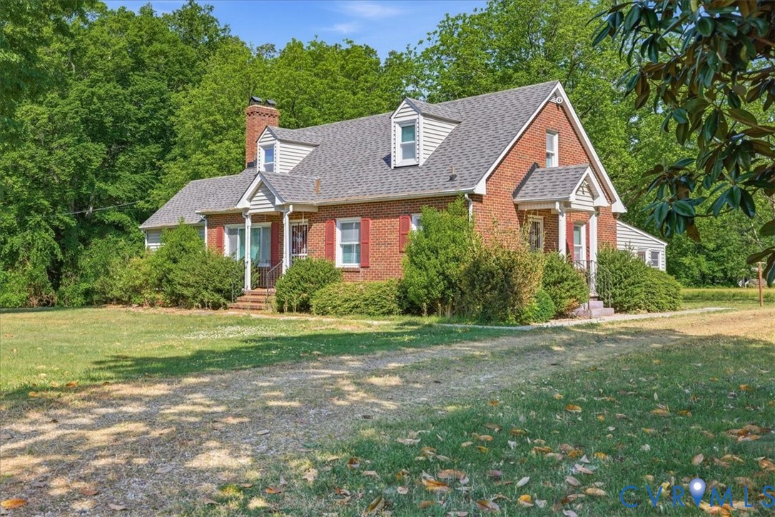 8100 Sandy Ridge Road Hopewell, VA 23860 - Photo 2 of 36 Brick residence with a gray shingle roof, featurin