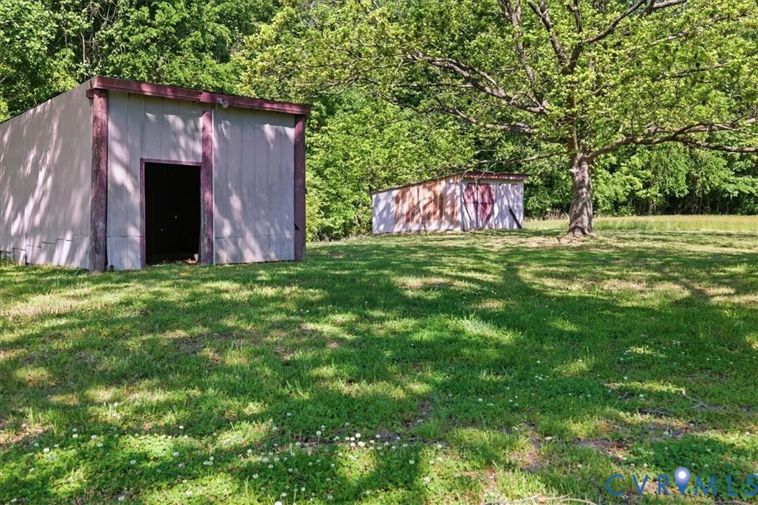 8100 Sandy Ridge Road Hopewell, VA 23860 - Photo 27 of 36 Expansive grassy area with two outbuildings