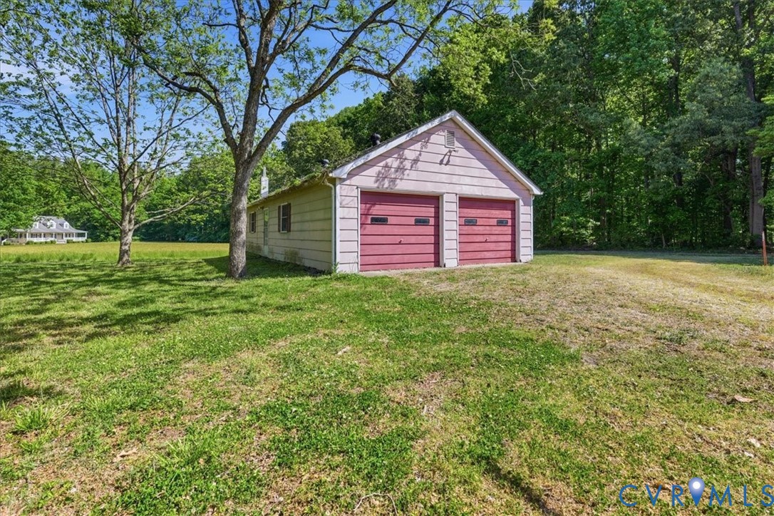 8100 Sandy Ridge Road Hopewell, VA 23860 - Photo 28 of 36 Detached two-car garage with red overhead doors an