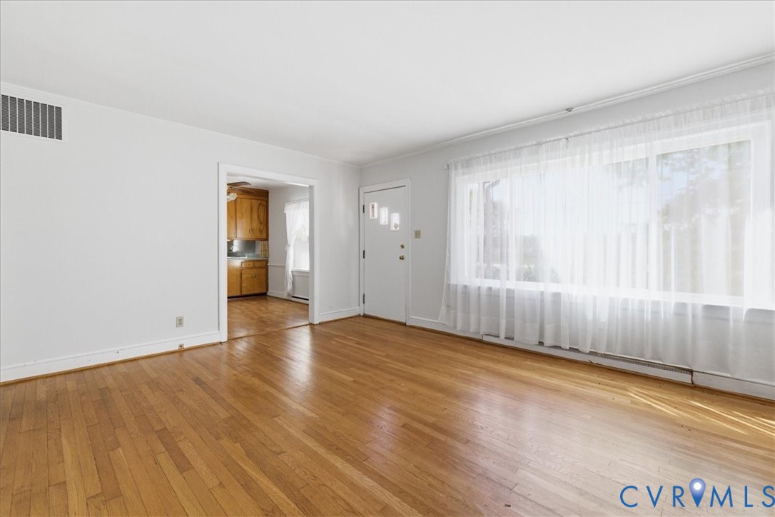 8100 Sandy Ridge Road Hopewell, VA 23860 - Photo 6 of 36 Expansive room featuring wood-finish flooring, a l