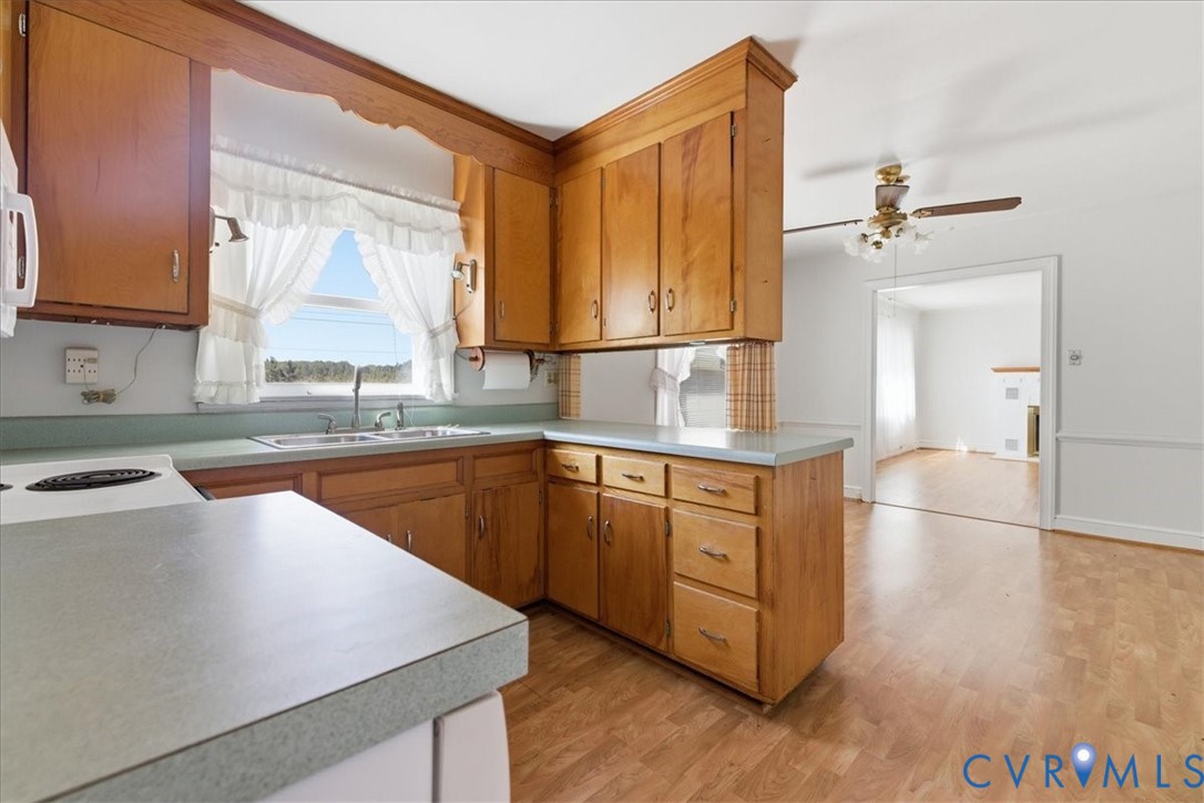 8100 Sandy Ridge Road Hopewell, VA 23860 - Photo 8 of 36 Kitchen featuring wood cabinetry, light-toned coun
