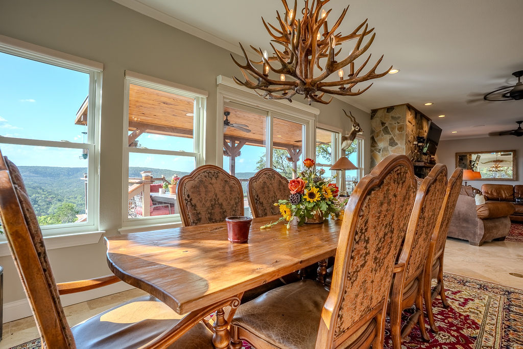 1950 Estrellita Ranch Road Canyon Lake, TX 78133 - Photo 21 of 34 a view of a dining room with furniture window and outside view