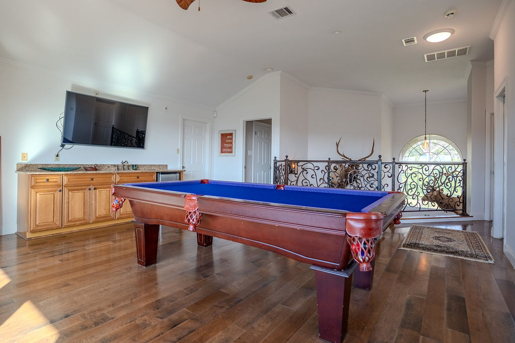 1950 Estrellita Ranch Road Canyon Lake, TX 78133 - Photo 28 of 34 a room with furniture pool table gym equipment wooden floor and window
