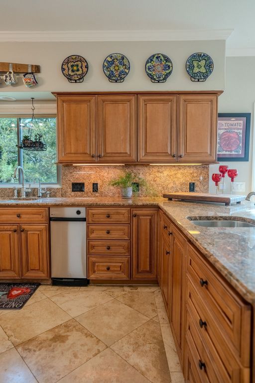 1950 Estrellita Ranch Road Canyon Lake, TX 78133 - Photo 31 of 34 a kitchen with stainless steel appliances granite countertop a sink and a stove