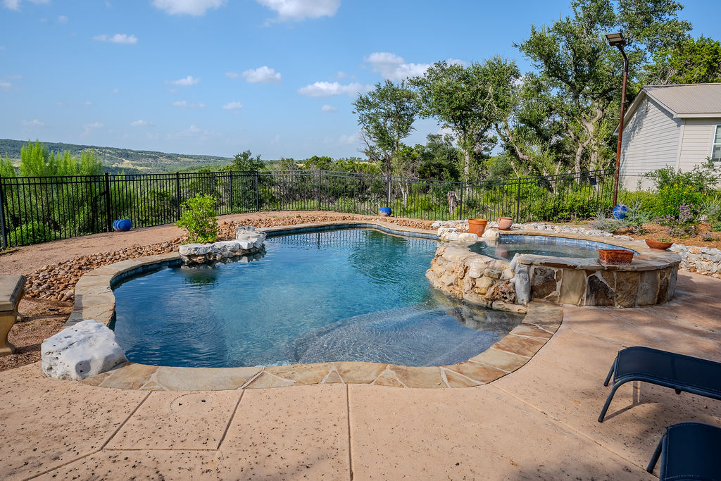 1950 Estrellita Ranch Road Canyon Lake, TX 78133 - Photo 5 of 34 a view of swimming pool with outdoor seating and plants