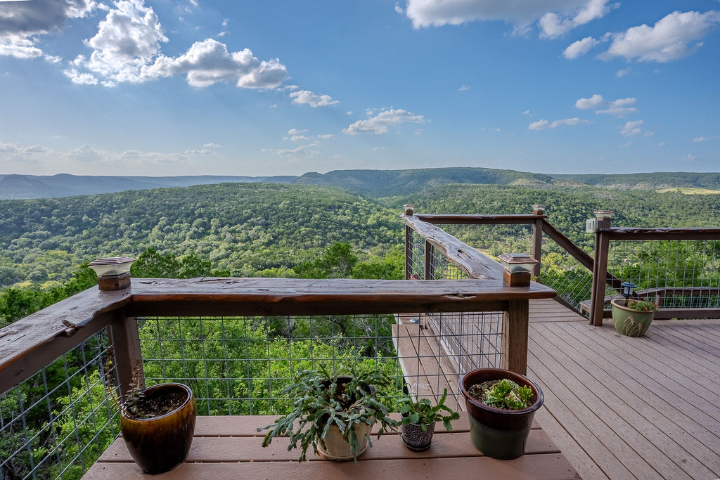 1950 Estrellita Ranch Road Canyon Lake, TX 78133 - Photo 8 of 34 a view of a balcony with lake view and a potted plant