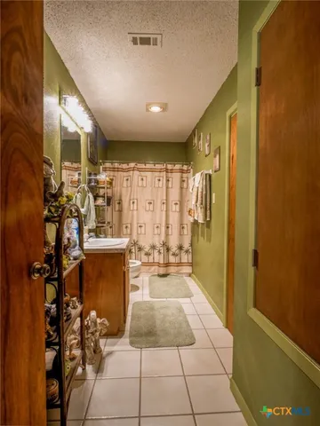 a lobby with furniture and a rug