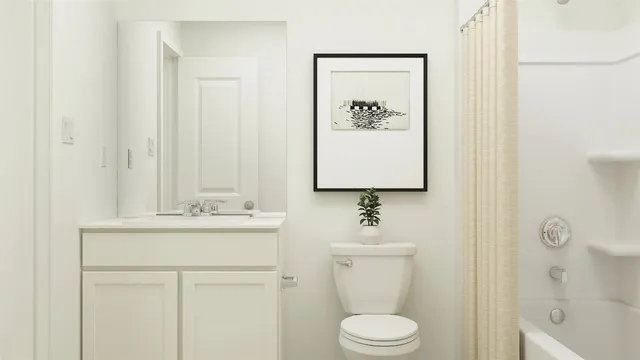 a bed room with a bed and a painting on the wall