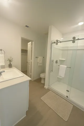 a bathroom with a shower and toilet