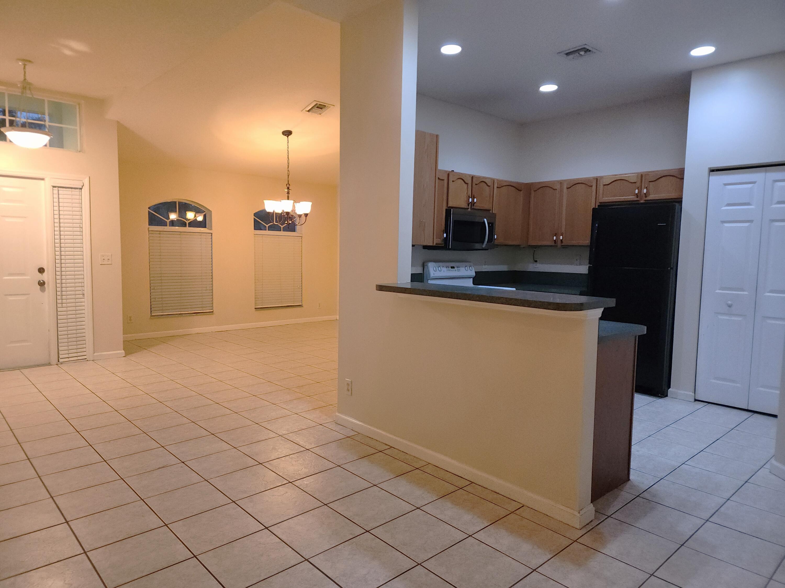 13426 85th Road North West Palm Beach, FL 33412 - Photo 4 of 21 eat-in dining with view of living room