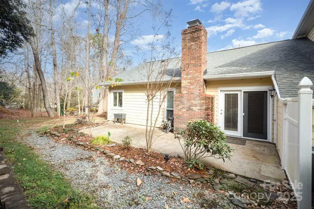a front view of a house with a yard garage and outdoor seating