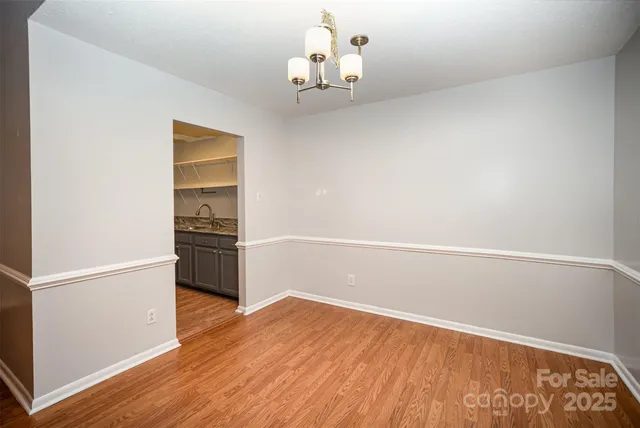a view of kitchen and wooden floor