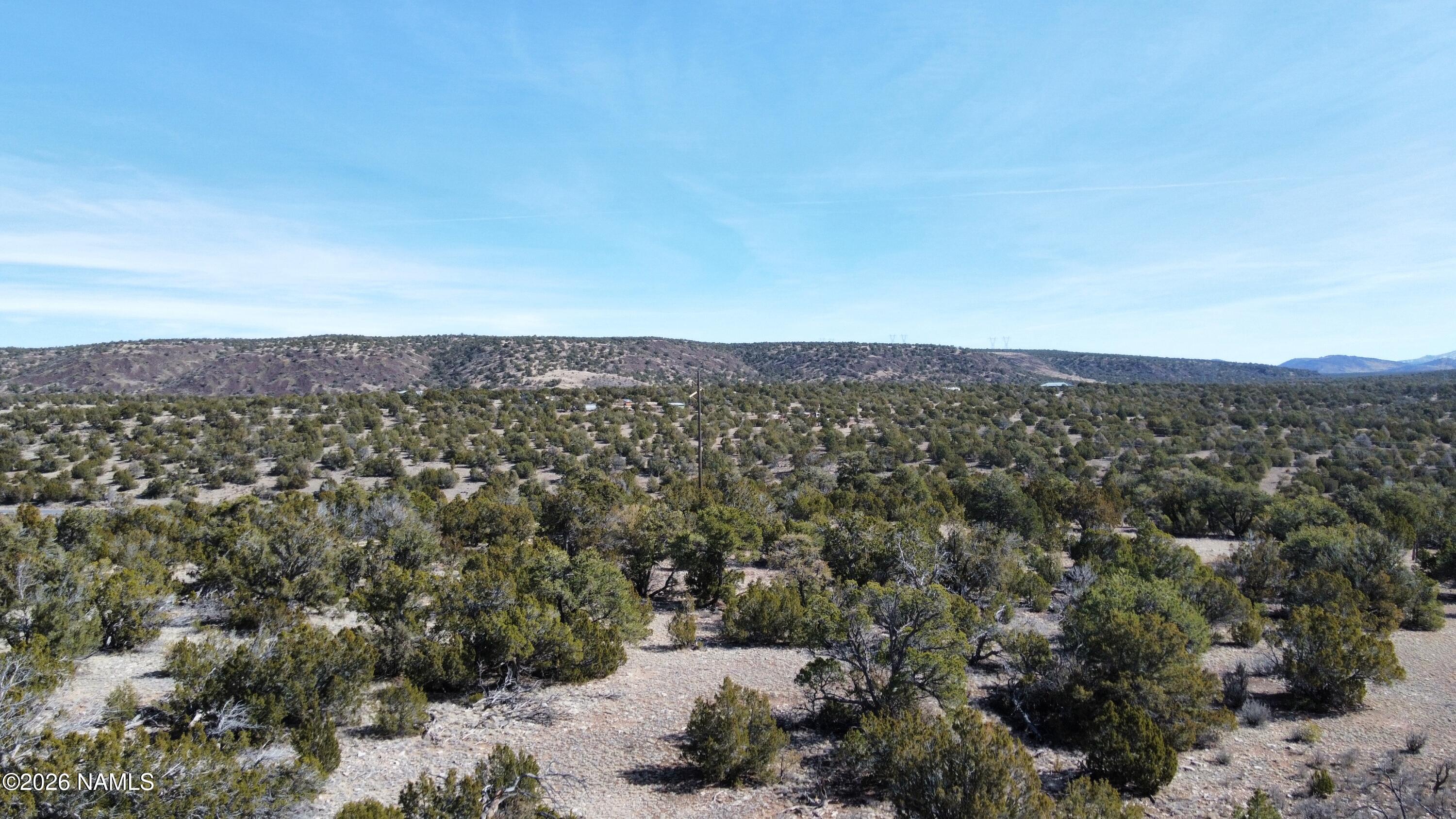 13537 Bly Station Road, Unit B Williams, AZ 86046 - Photo 5 of 10 an aerial view of house with yard and mountain view in back