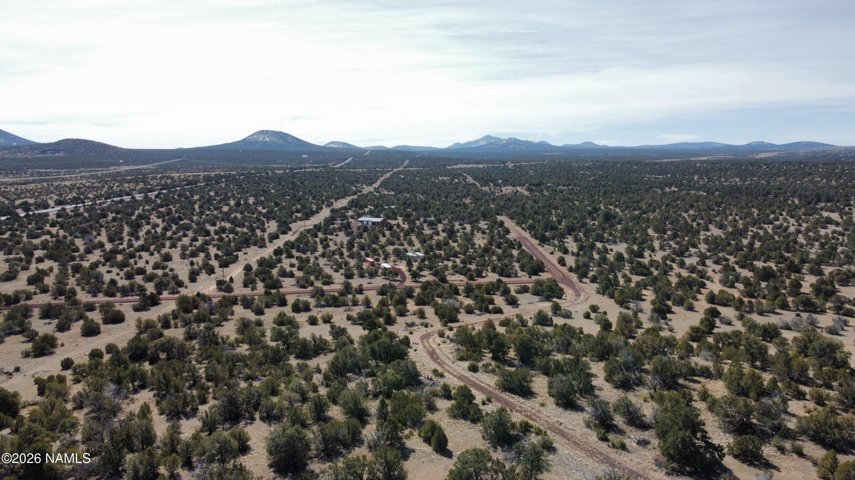 13537 Bly Station Road, Unit B Williams, AZ 86046 - Photo 8 of 10 an aerial view of houses covered in trees