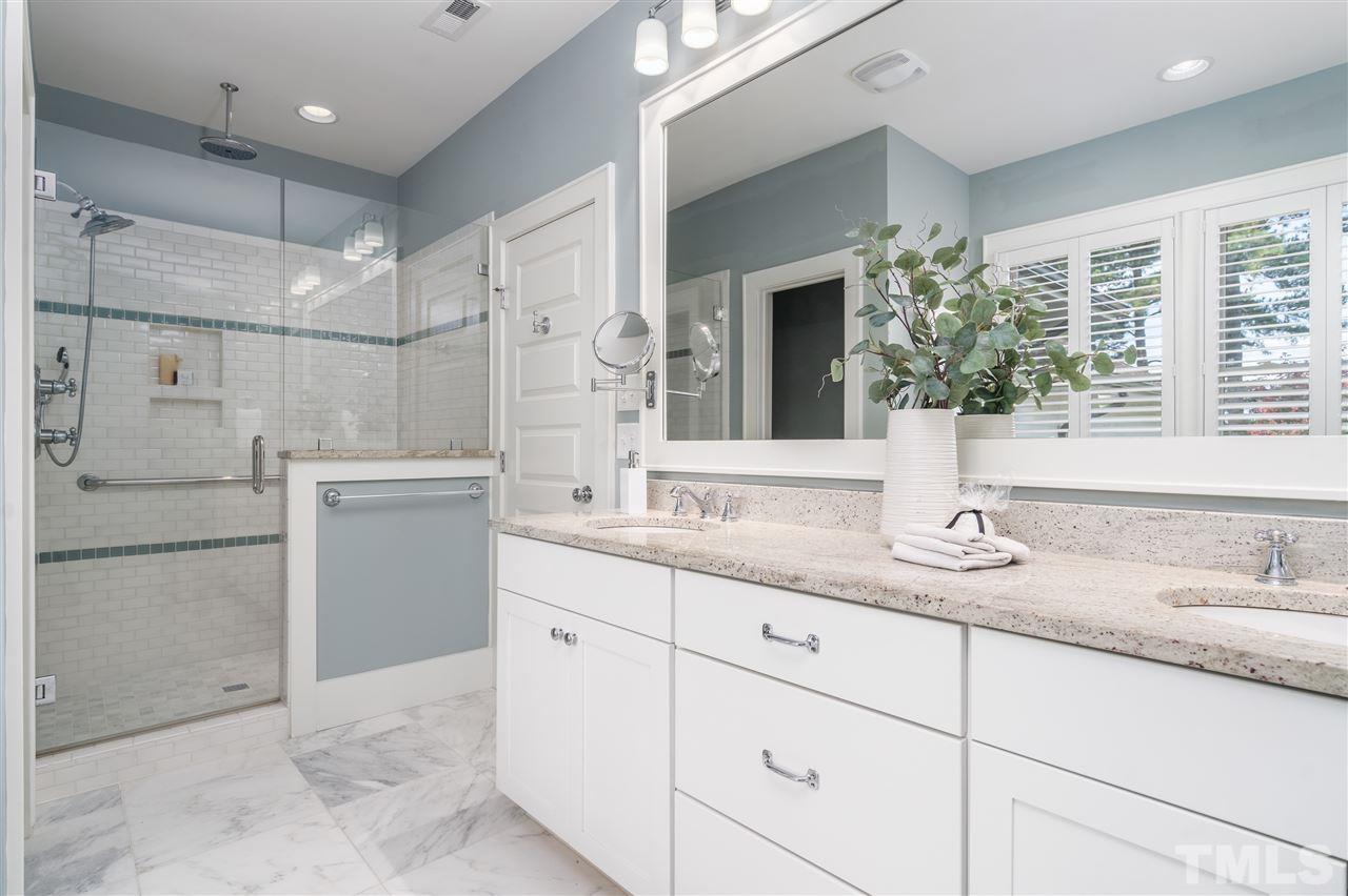 2324 Yancey Street Raleigh, NC 27608 - Photo 18 of 29 The owner's bath features a full walk in tower as well as soaking tub.