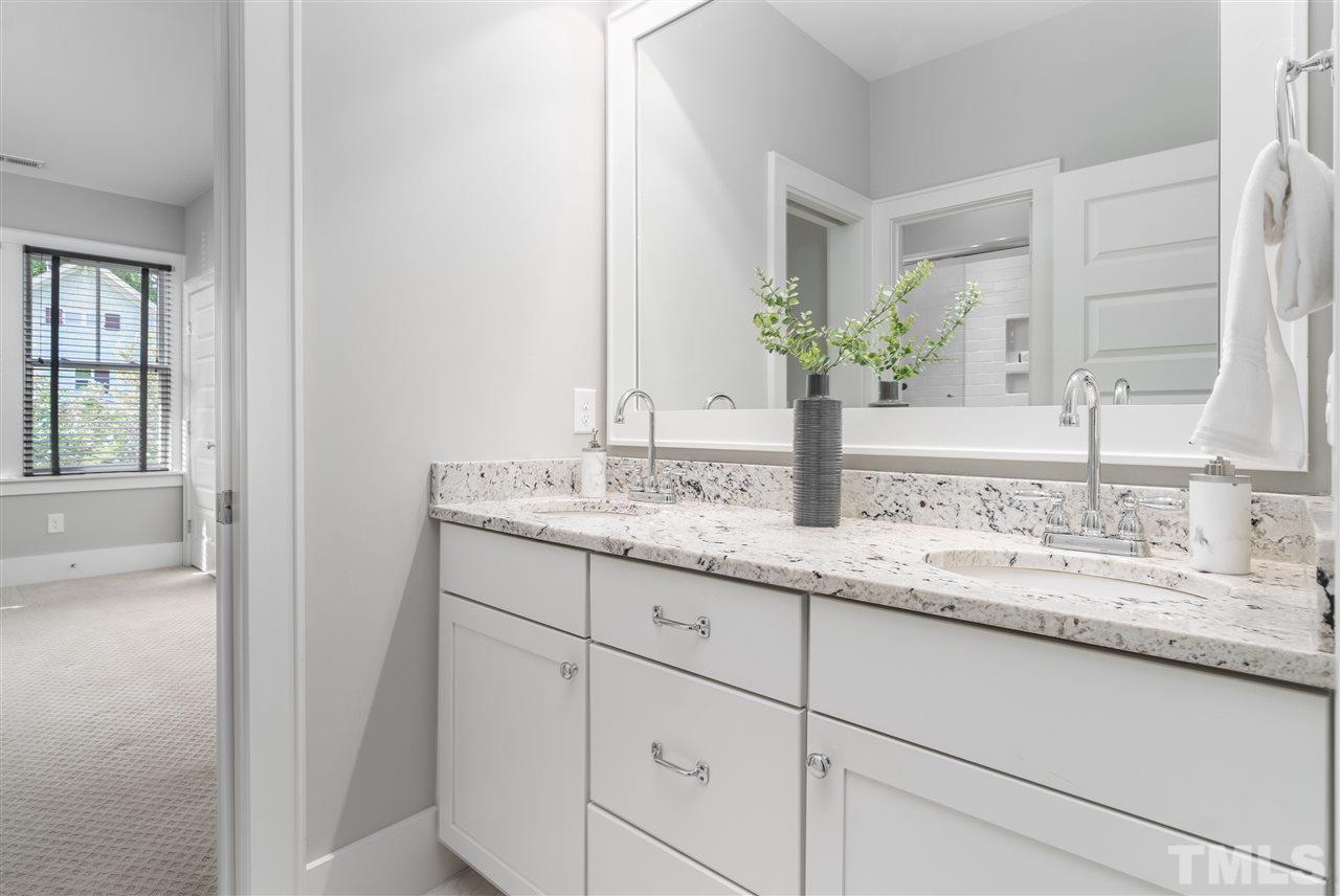 2324 Yancey Street Raleigh, NC 27608 - Photo 22 of 29 This Jack and Jill full bath serves both bedrooms 3 & 4.