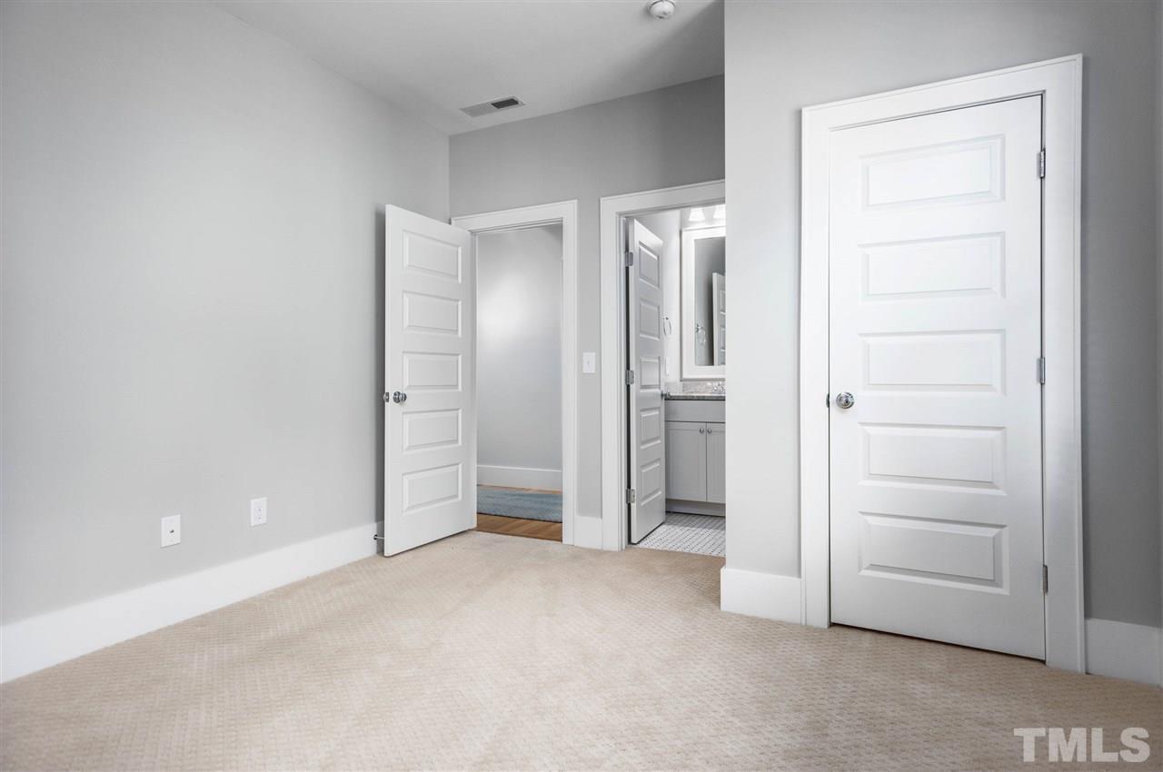 2324 Yancey Street Raleigh, NC 27608 - Photo 23 of 29 Bedroom 5 features a full en-suite bath.