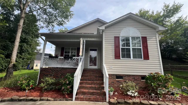 a front view of a house with a porch