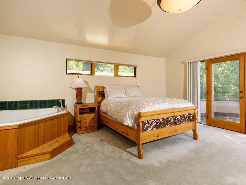 421 Original Basalt, CO 81621 - Photo 7 of 10 a bedroom with a bed and window