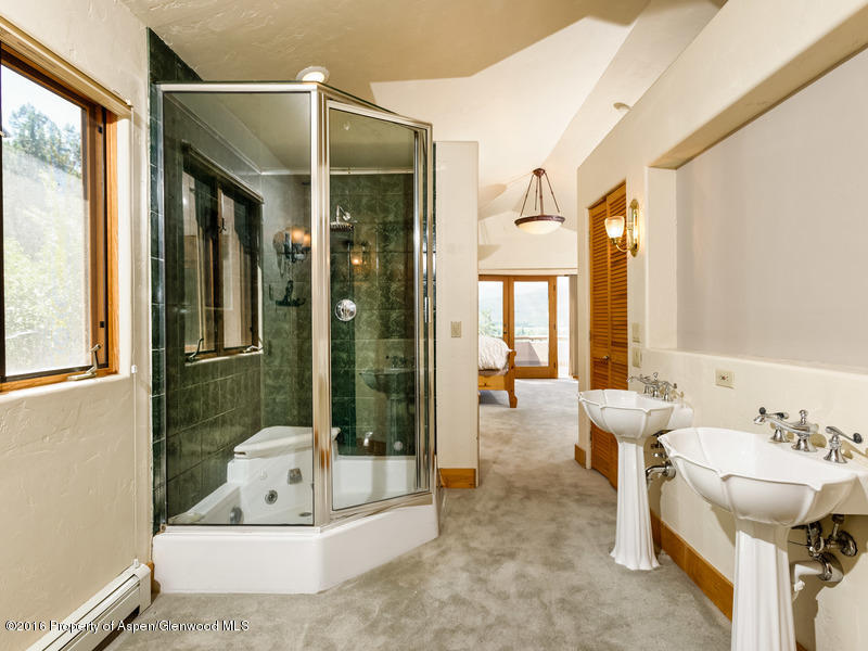 421 Original Basalt, CO 81621 - Photo 8 of 10 a bathroom with a tub sink and mirror