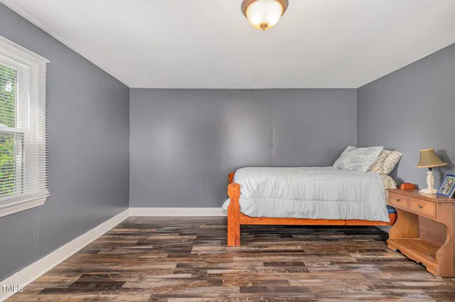 a bedroom with a bed and a closet