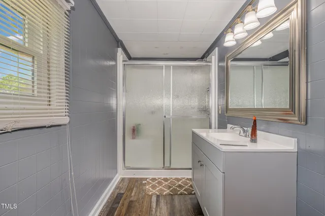 a bed room with a bed and a window